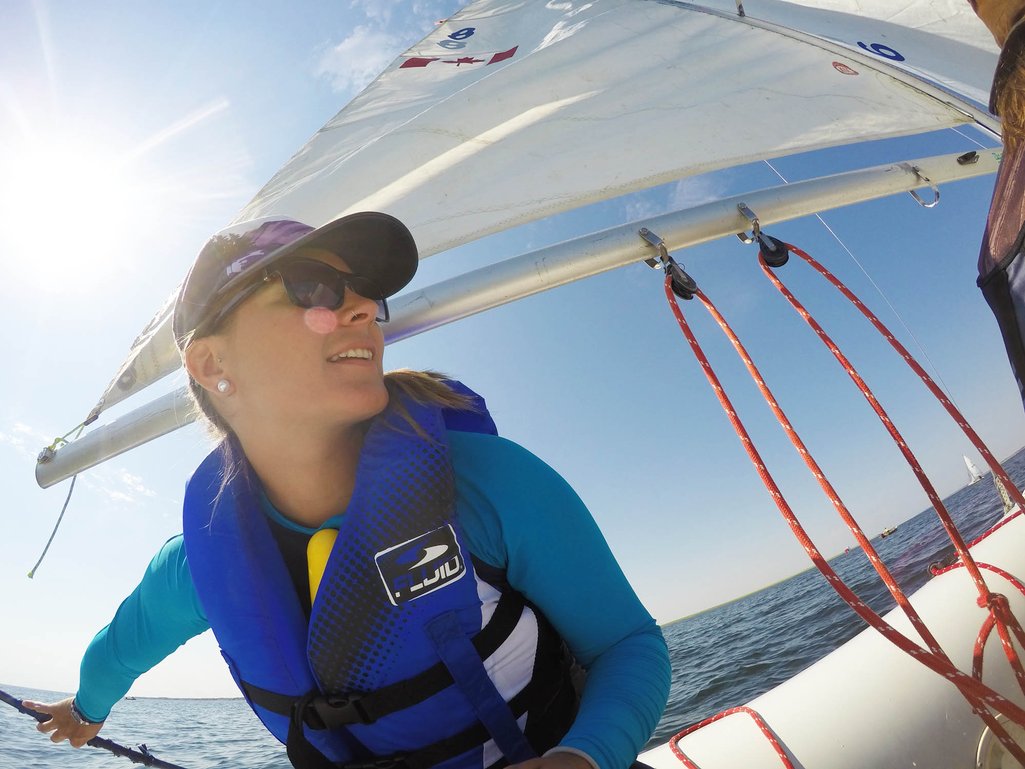 close up action shot of Ashlyn George sailing on Lake Deifenbaker