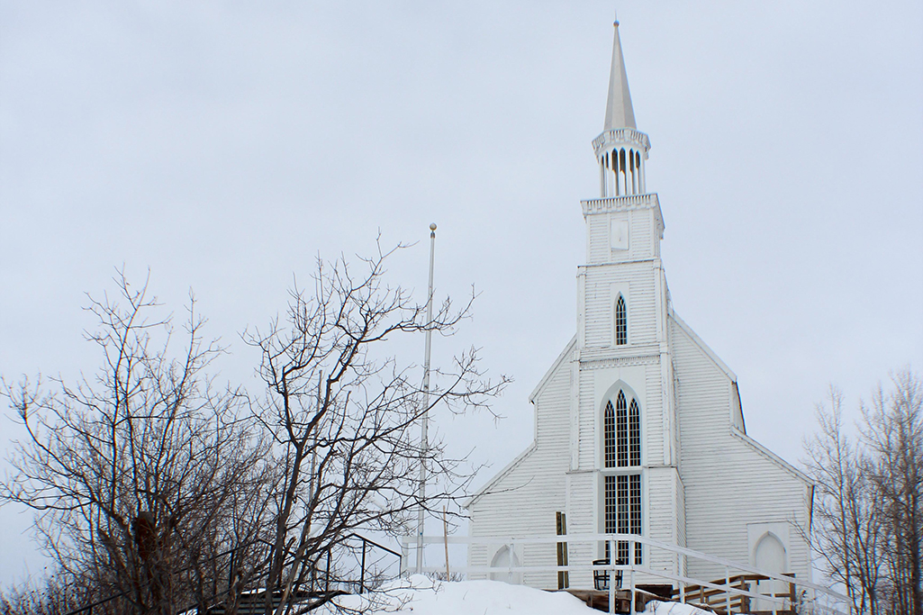 A wintertime view of Holy Trinity Anglican Church in Stanley Mission located in Northern Saskatchewan