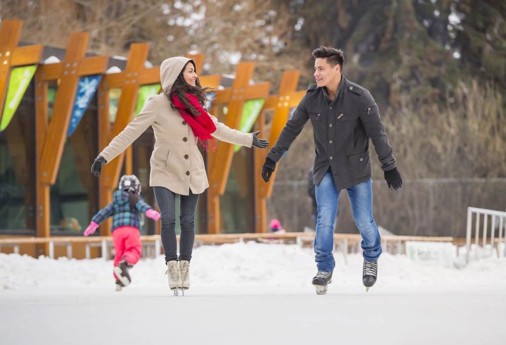 picture of a couple ice skating outside