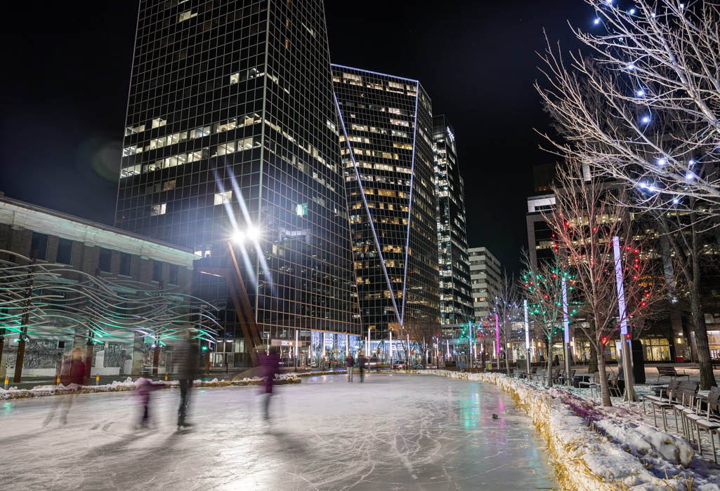 people ice skating at outdoor rink in downtown regina