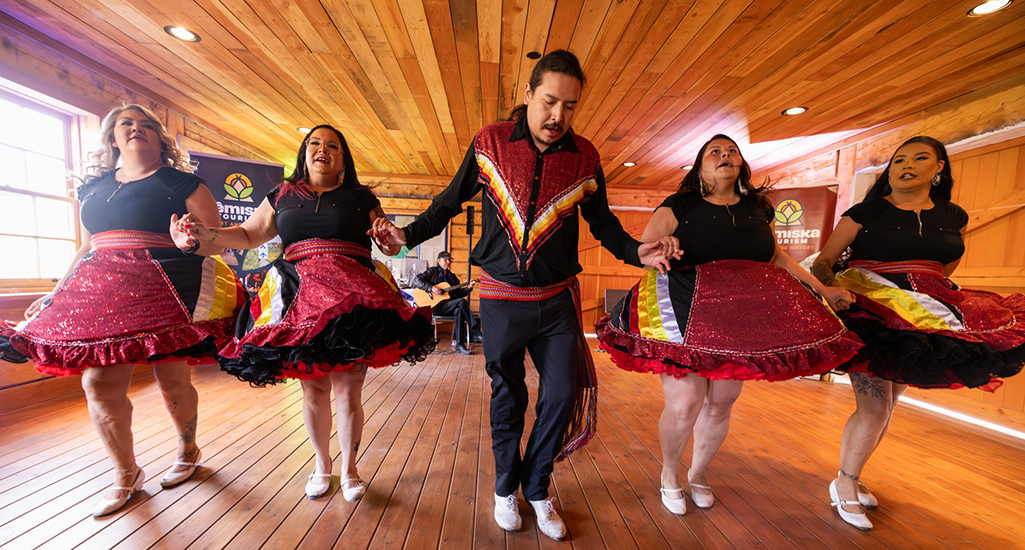 indigenous performers in costume