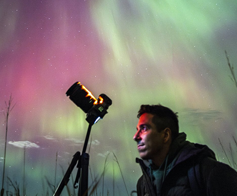 camera pointed at aurora borealis