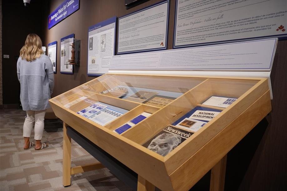 A visitor enjoying the Diefenbaker Canada Centre’s past exhibit “Fostering a Vision for Canada: Diefenbaker’s Legacy”