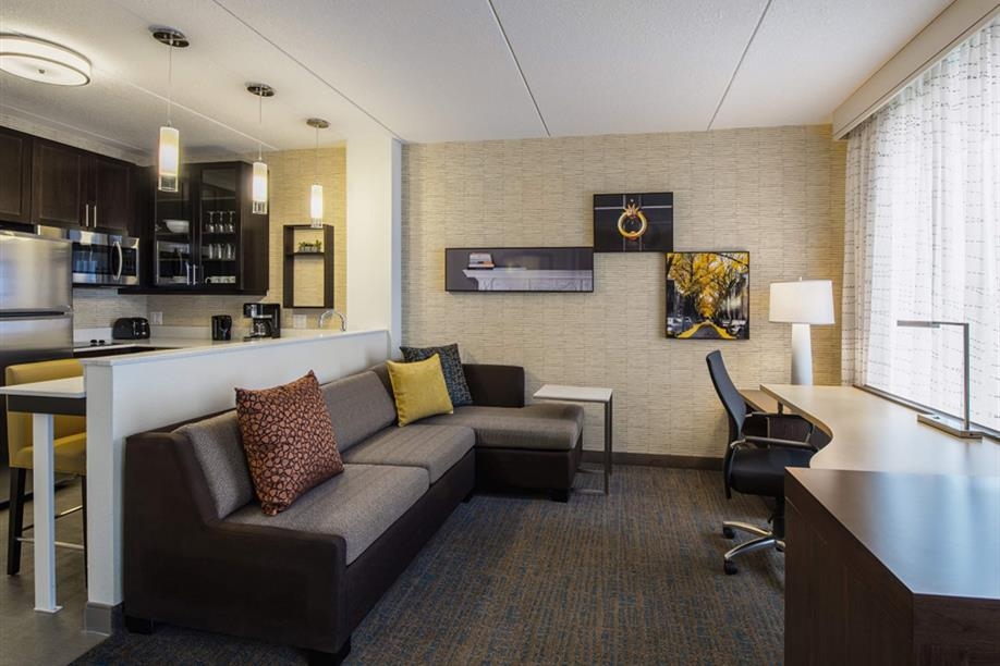 Residence Inn by Marriott Regina - The living and kitchen area of the Studio King